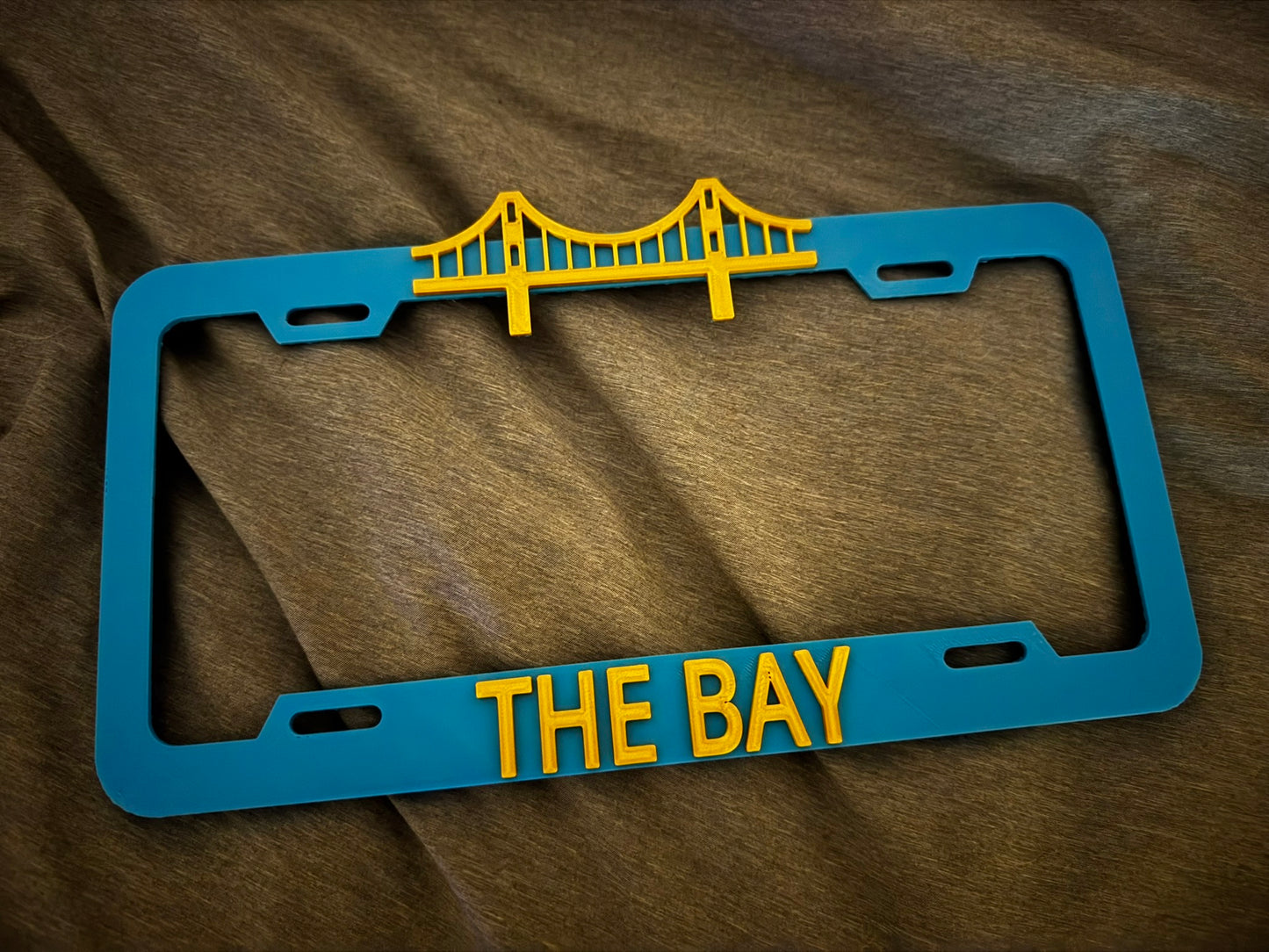 THE BAY License Plate Cover Sky Blue/Silk Gold